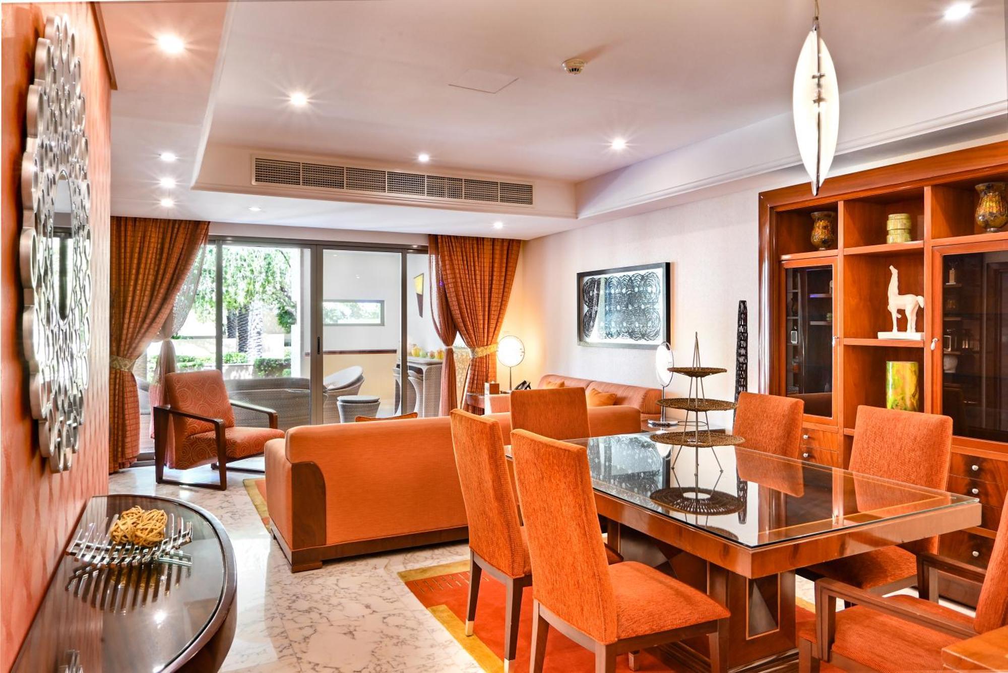 Palavra Resort Manama Exterior foto A living room in a suite at the hotel